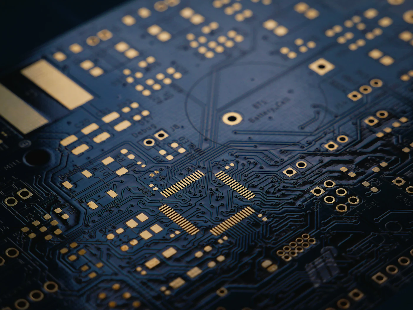 Macro photograph of a dark blue circuit board